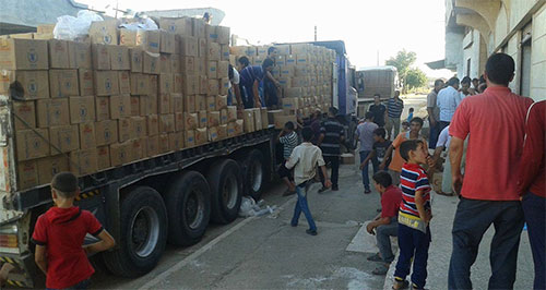 reparto de ayuda humanitaria en Homs